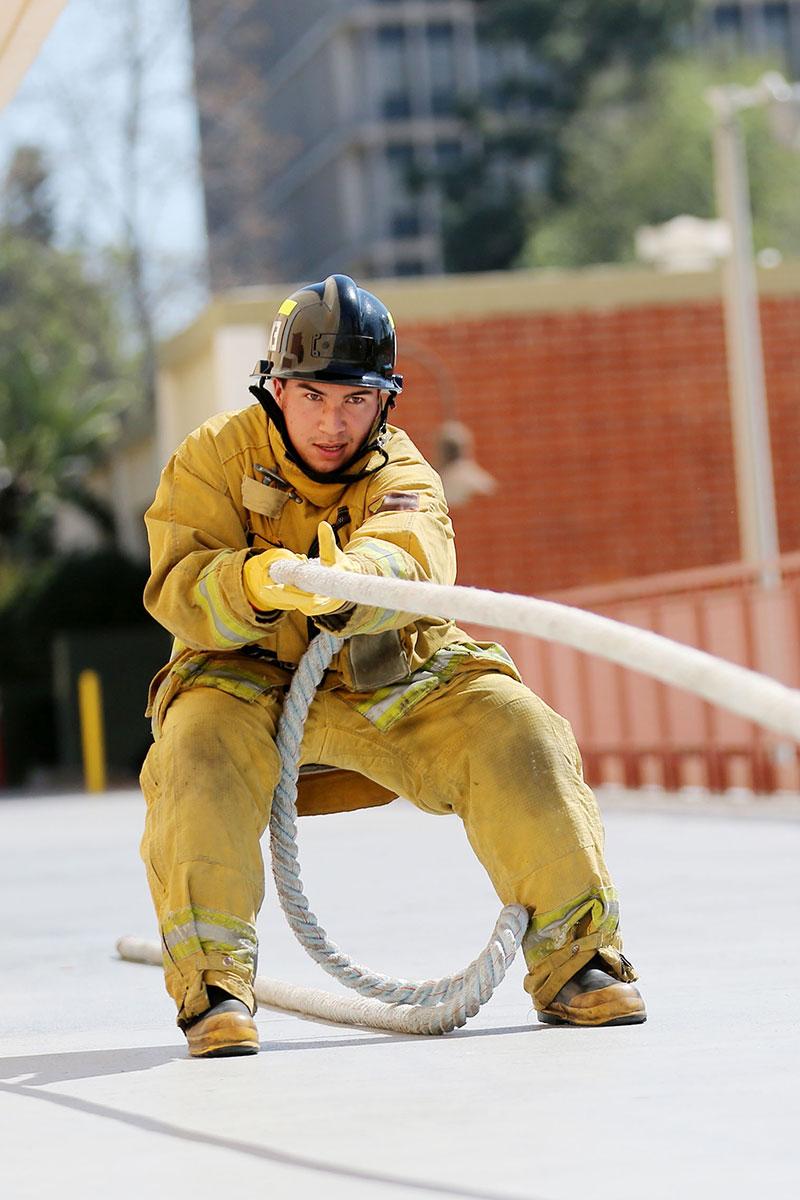 A student fire fighter training.